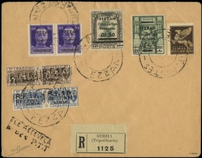 FEZZAN 1943 - 01+2+5+13/14+PA1: sette esemplari su busta filatelica con etichetta di raccomandazione